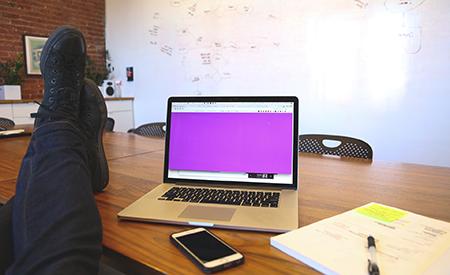 stock image man with feet on desk